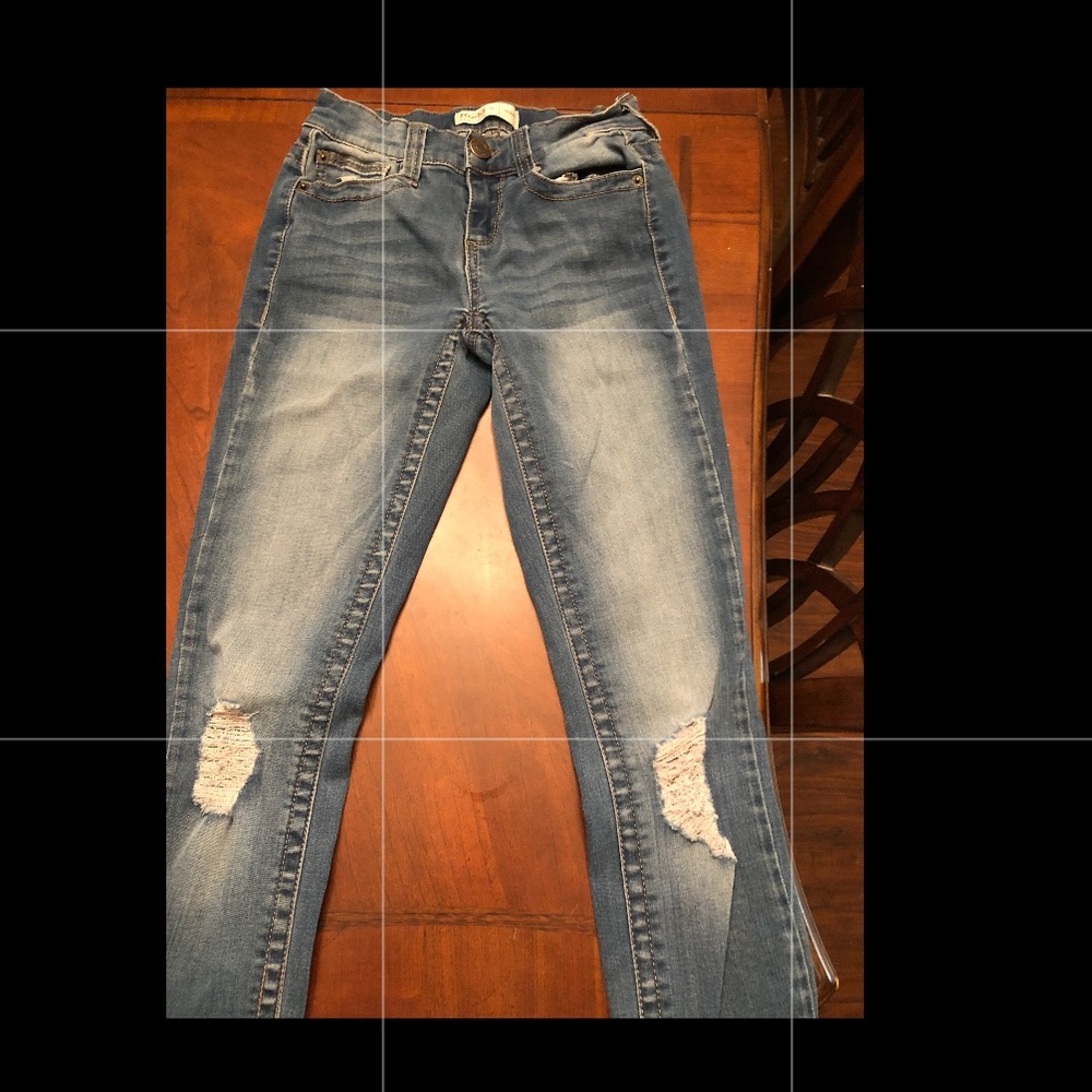 medium wash jeans with rips on knees